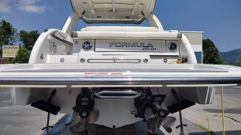 Slide: The Image of 2020 Formula 350 CBR boat rear view with dual propellers and sleek design. - 7