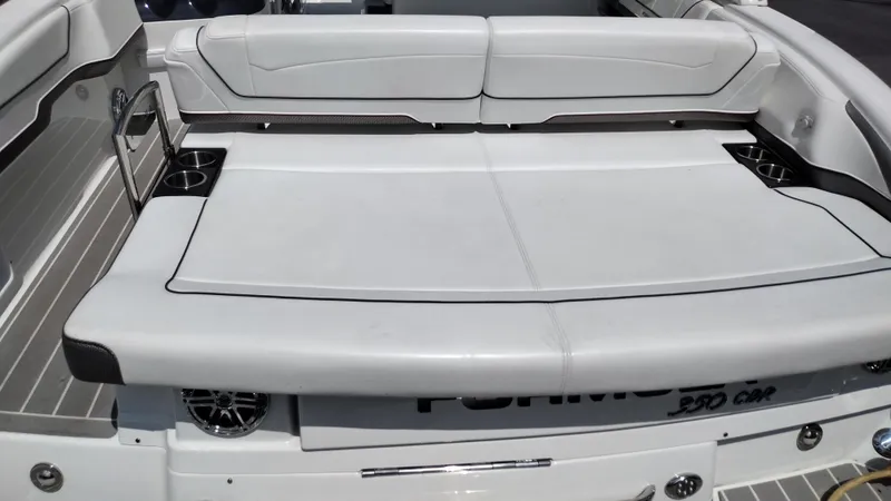 Slide: The Image of 2020 Formula 350 CBR boat interior with white seating and cup holders. - 9