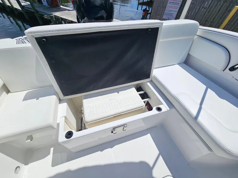 Slide: The Image of 2017 Monterey 217 Outboard boat interior with open storage compartment and seating. - 12