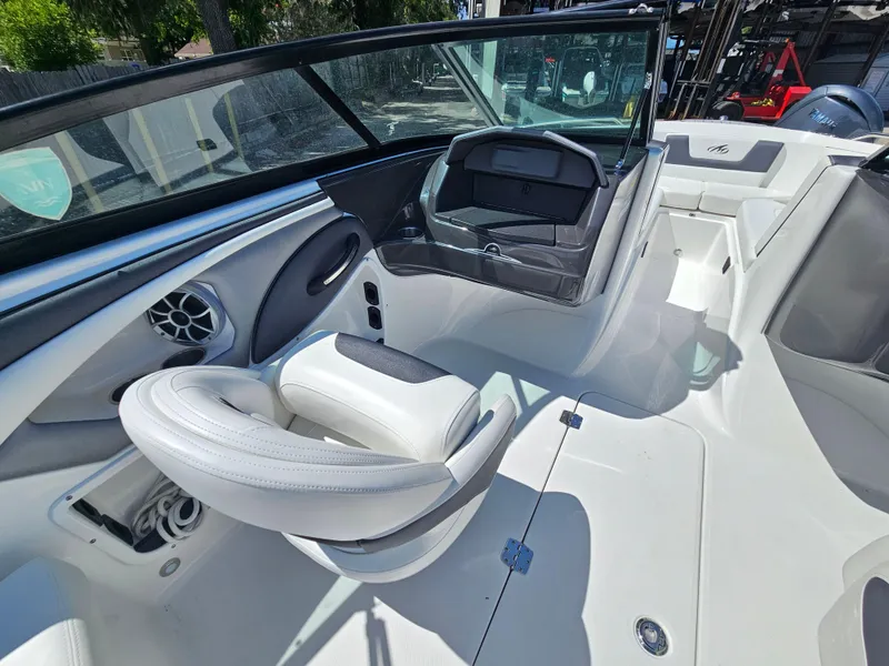 Slide: The Image of 2017 Monterey 217 Outboard boat interior with white seating and modern dashboard. - 15