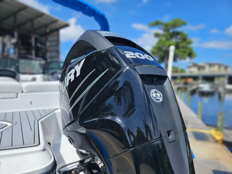 Slide: The Image of Close-up of a 2017 Monterey 217 Outboard boat engine at a marina. - 2