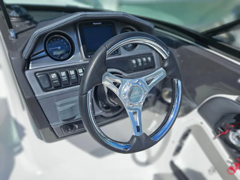 Slide: The Image of Steering wheel and dashboard of 2017 Monterey 217 Outboard boat. - 21