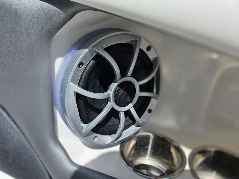 Slide: The Image of Speaker and cup holders on 2017 Monterey 217 Outboard boat interior. - 22