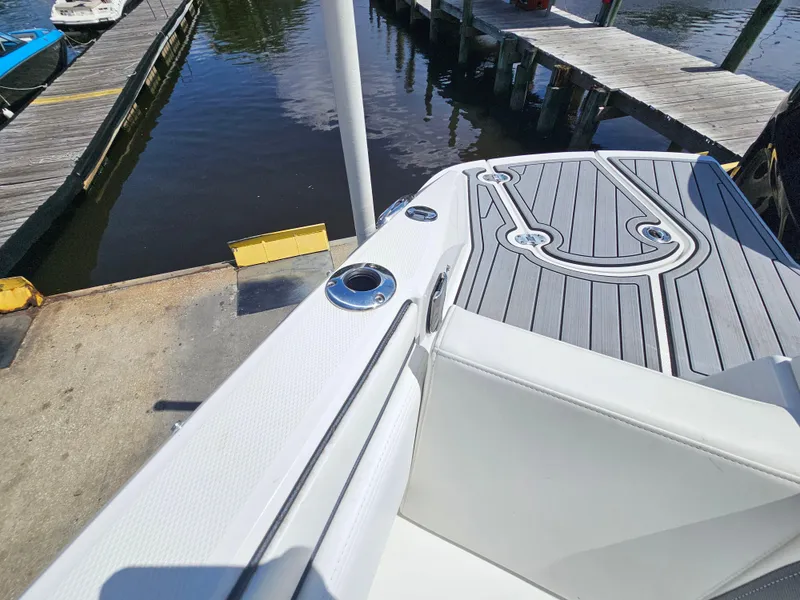 Slide: The Image of 2017 Monterey 217 Outboard boat docked, featuring sleek deck design and modern fittings. - 26