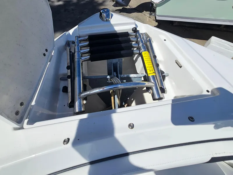 Slide: The Image of 2017 Monterey 217 Outboard boat anchor storage with ladder, in bright sunlight. - 30