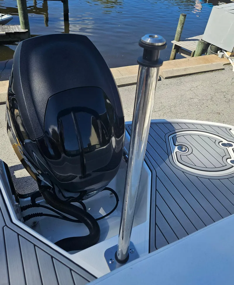 Slide: The Image of 2017 Monterey 217 Outboard boat engine and deck by the water. - 36