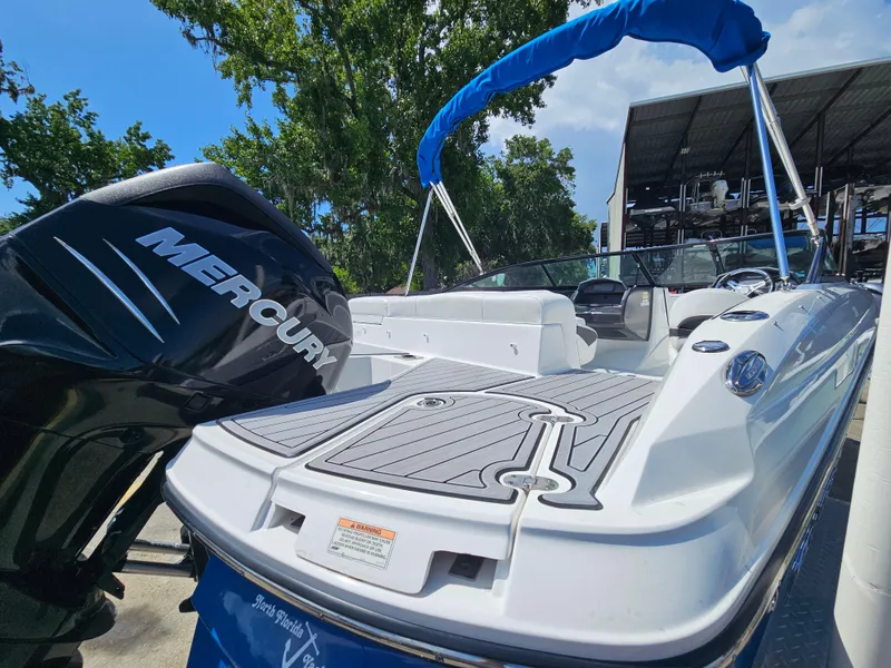 Slide: The Image of 2017 Monterey 217 Outboard boat with Mercury engine, docked under blue sky. - 8