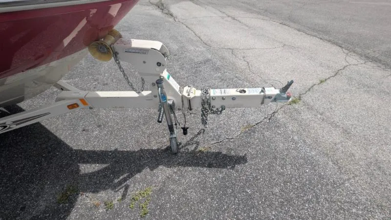 Slide: The Image of Trailer hitch of a 2006 Sea Ray 185 Sport boat on asphalt. - 10