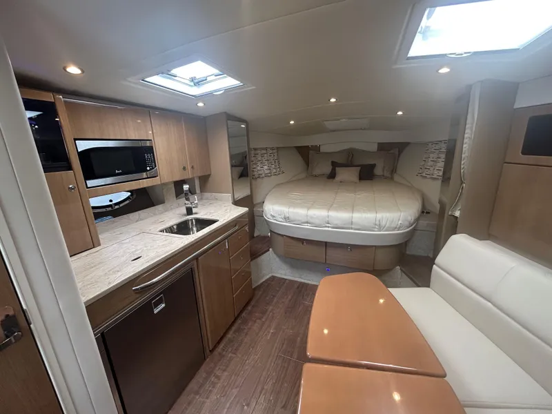 Slide: The Image of Interior of 2021 Formula 34 Performance Cruiser with kitchen, bed, and seating area. - 12