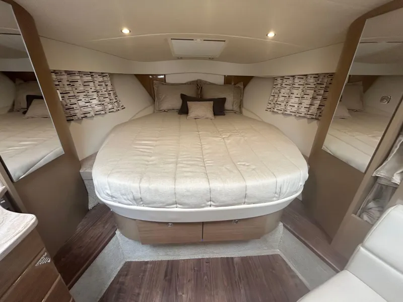 Slide: The Image of 2021 Formula 34 Performance Cruiser interior cabin with cozy bed and modern decor. - 13