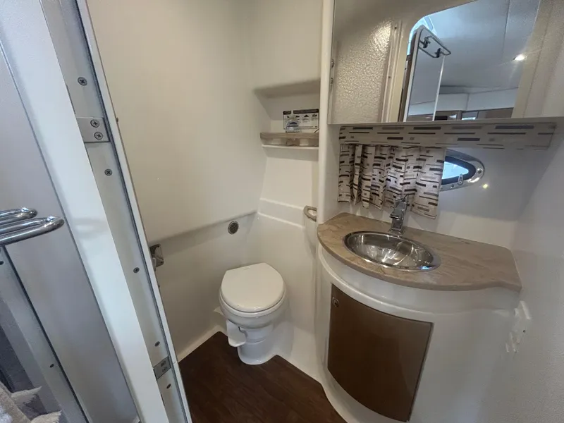 Slide: The Image of 2021 Formula 34 Performance Cruiser bathroom with modern sink, toilet, and stylish decor. - 16
