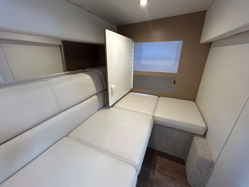 Slide: The Image of Interior of 2021 Formula 34 Performance Cruiser with beige seating and storage compartment. - 18