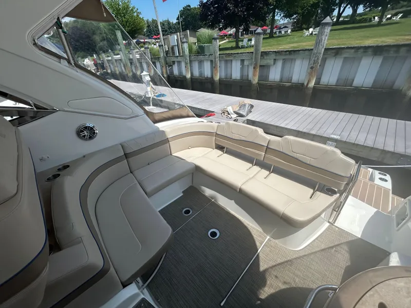 Slide: The Image of 2021 Formula 34 Performance Cruiser with spacious seating, docked by a wooden pier. - 6
