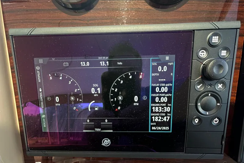 Slide: The Image of Dashboard of a 2021 Formula 34 Performance Cruiser displaying navigation and engine data. - 9