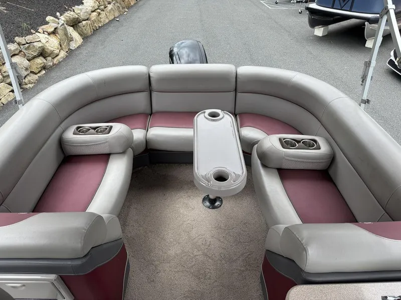Slide: The Image of 2015 Premier 250 Solaris boat interior with U-shaped seating and cup holders. - 11