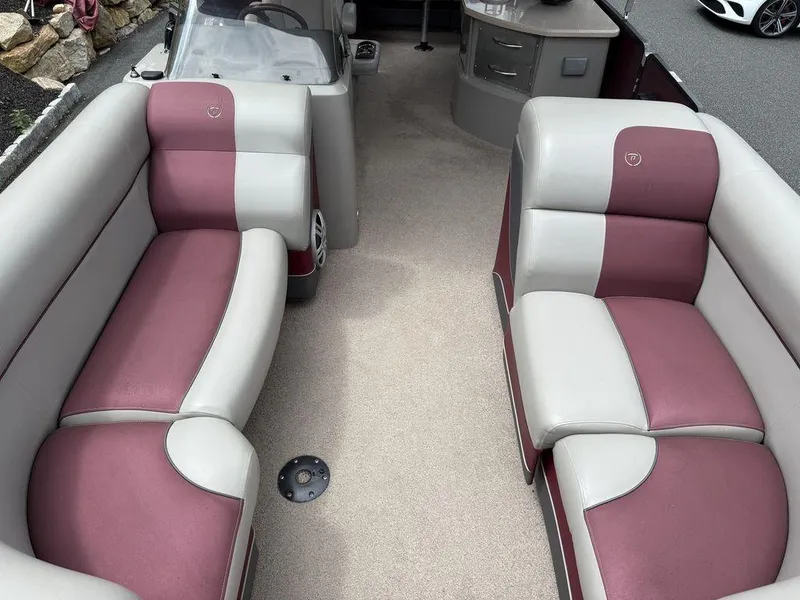 Slide: The Image of 2015 Premier 250 Solaris boat interior with maroon and gray seating. - 13