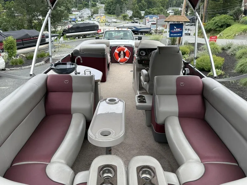 Slide: The Image of Luxurious 2015 Premier 250 Solaris pontoon boat with spacious seating and modern amenities. - 9