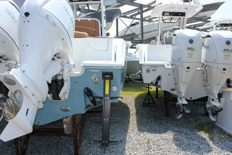 Slide: The Image of 2026 Sea Hunt Ultra 265 SE boat with Yamaha outboard engines in storage. - 12