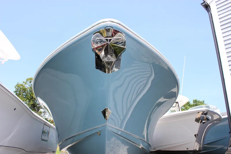 Slide: The Image of 2026 Sea Hunt Ultra 265 SE boat, sleek hull design, viewed from the front. - 14