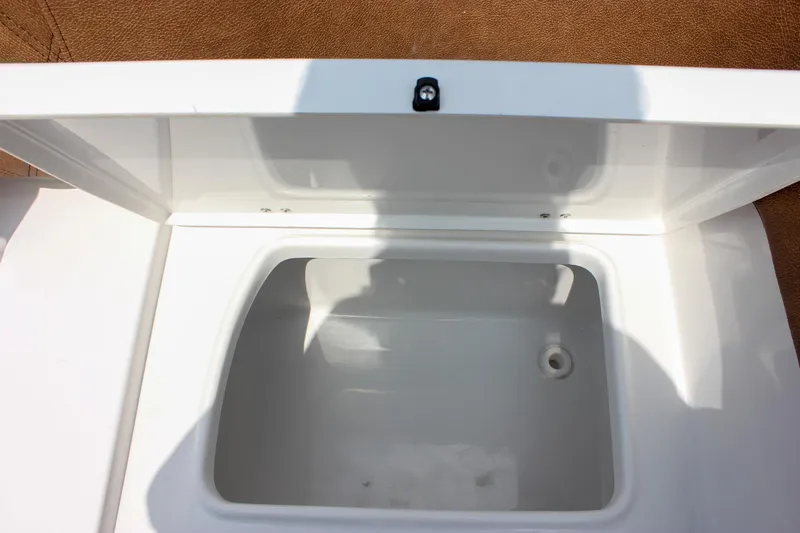 Slide: The Image of Open storage compartment on 2026 Sea Hunt Ultra 265 SE boat. - 23