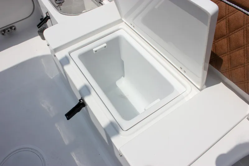 Slide: The Image of Open storage compartment on 2026 Sea Hunt Ultra 265 SE boat. - 24