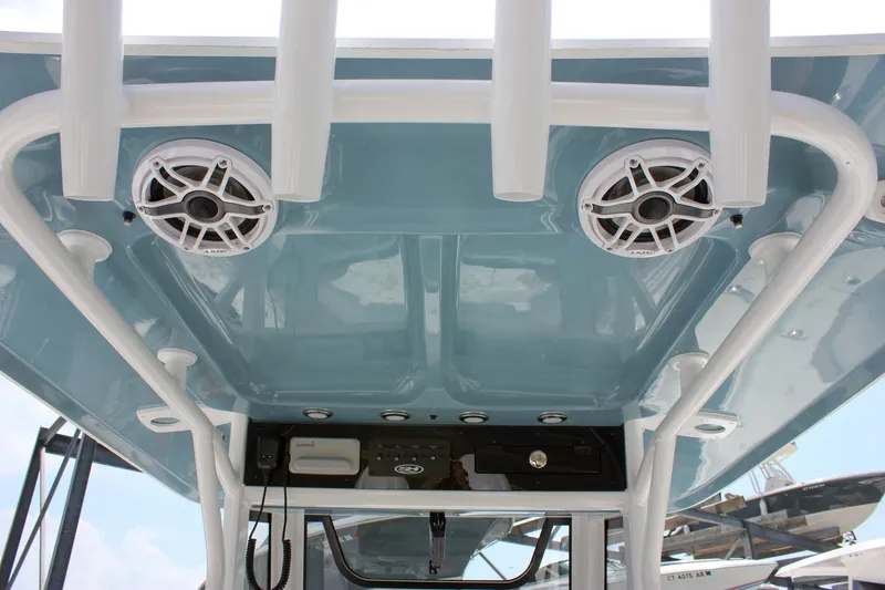Slide: The Image of 2026 Sea Hunt Ultra 265 SE boat roof with speakers and rod holders. - 29