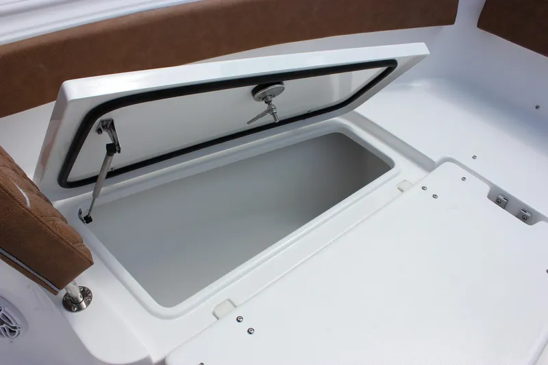 Slide: The Image of Open storage compartment on 2026 Sea Hunt Ultra 265 SE boat. - 36
