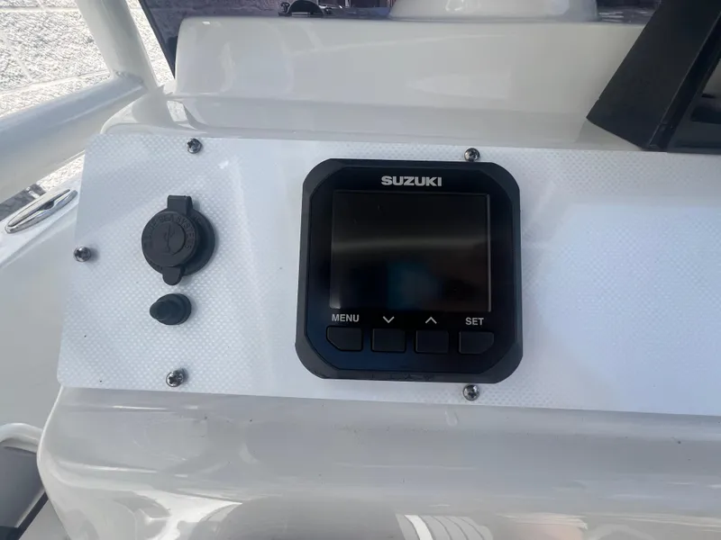 Slide: The Image of Dashboard of 2021 Key Largo 1801 CC boat with Suzuki display. - 11