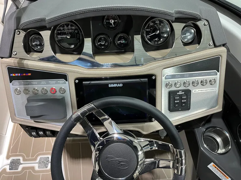 Slide: The Image of Dashboard of 2023 Monterey 298 Super Sport boat with steering wheel and control panels. - 10