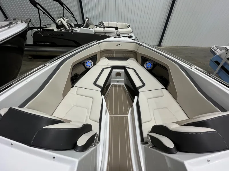 Slide: The Image of 2023 Monterey 298 Super Sport boat interior with luxurious seating and modern design. - 12