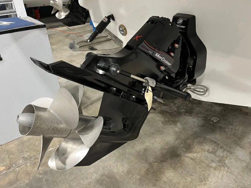 Slide: The Image of 2023 Monterey 298 Super Sport boat with MerCruiser outdrive and dual propellers. - 3