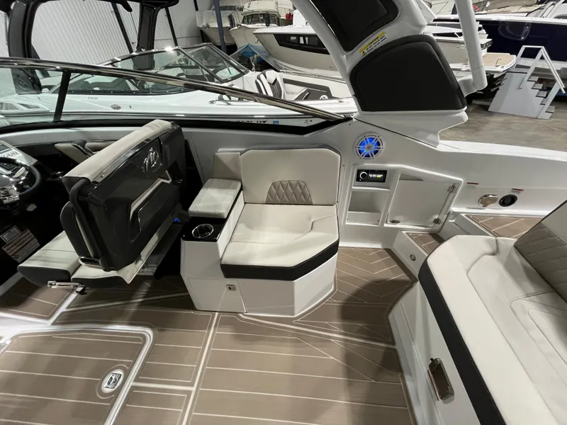 Slide: The Image of 2023 Monterey 298 Super Sport boat interior with modern seating and sleek design. - 6