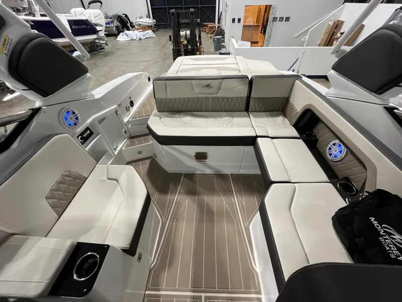 Slide: The Image of 2023 Monterey 298 Super Sport boat interior with luxurious seating and modern design. - 8