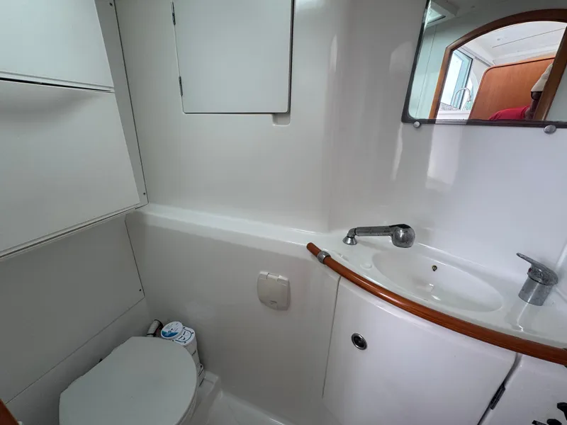 Slide: The Image of Bathroom interior of 2000 Lagoon 380 catamaran with sink and toilet. - 26