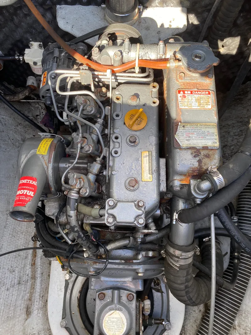 Slide: The Image of Engine of a 2000 Lagoon 380 catamaran, showing detailed components and labels. - 27