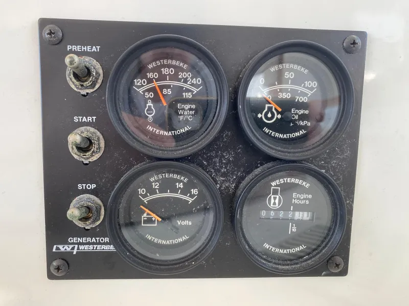 Slide: The Image of Control panel of a 2000 Lagoon 380 with Westerbeke gauges and switches. - 31