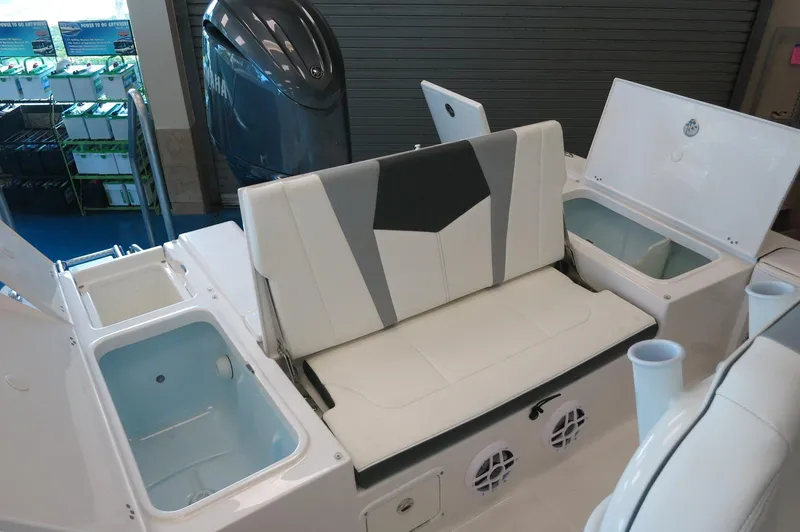 Slide: The Image of 2025 Robalo 226 Cayman boat interior with seating and storage compartments. - 26