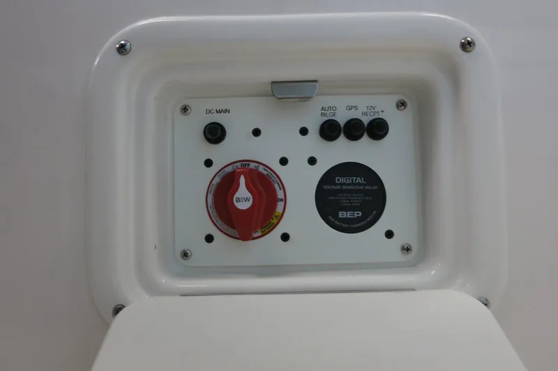 Slide: The Image of Control panel of 2025 Robalo 226 Cayman boat with switches and digital relay. - 36