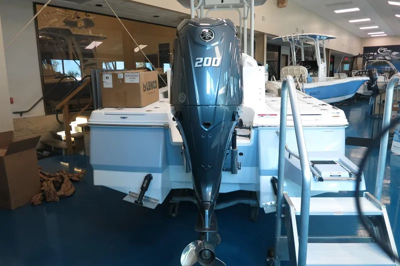 Slide: The Image of 2025 Robalo 226 Cayman boat with Yamaha 200 engine in showroom. - 5