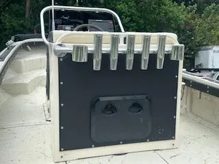 Slide: The Image of 1976 Boston Whaler 21 Outrage boat interior with rod holders and steering console. - 13