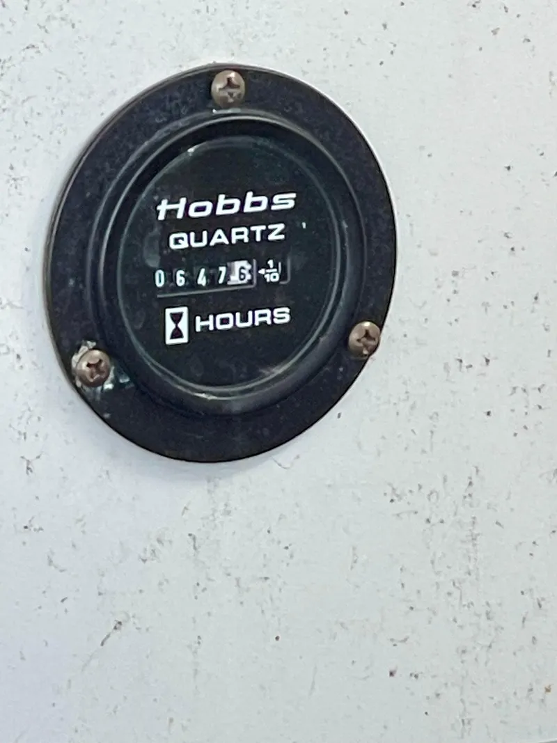 Slide: The Image of Hobbs quartz hour meter showing 647.6 hours on a 2006 Cobalt 323. - 9