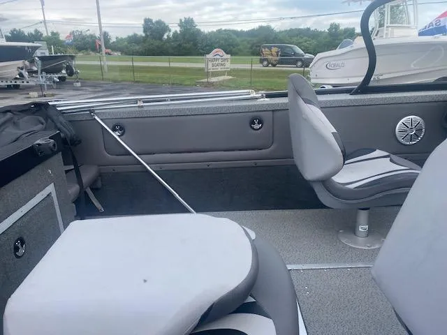 Slide: The Image of Interior of a 2019 Starweld Fusion Pro 18 DC boat with gray seating. - 8