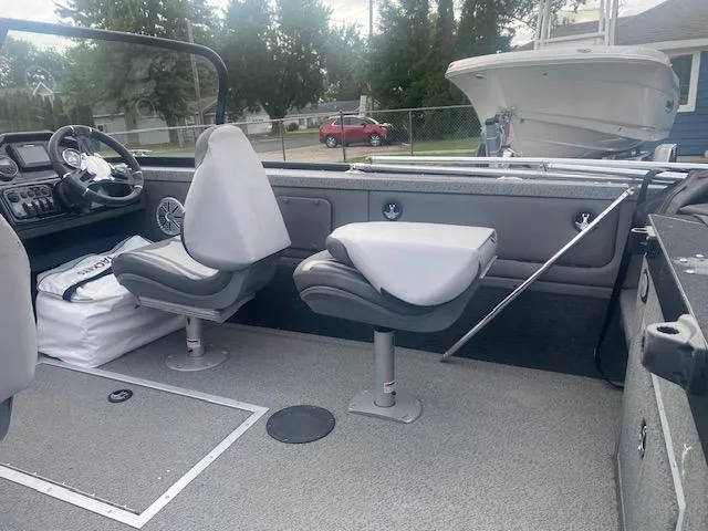 Slide: The Image of Interior of a 2019 Starweld Fusion Pro 18 DC boat with seating and steering console. - 9