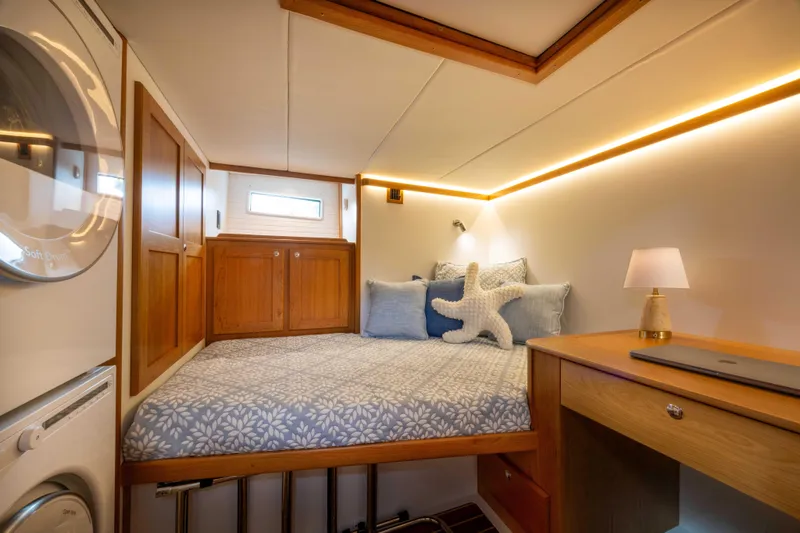 Slide: The Image of Luxurious cabin interior of 2026 Sabre 51 Salon Express yacht with cozy bed and modern amenities. - 17