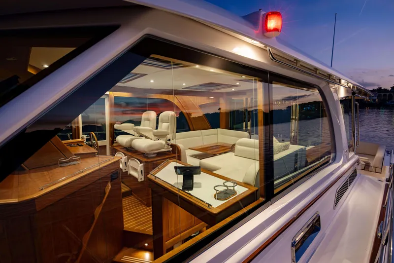 Slide: The Image of Luxurious interior of 2026 Sabre 51 Salon Express yacht at sunset, featuring elegant seating. - 18