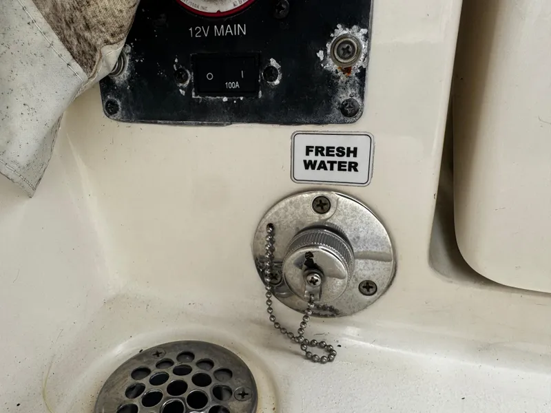 Slide: The Image of Fresh water access on 2015 Cobia 237 Center Console boat. - 17