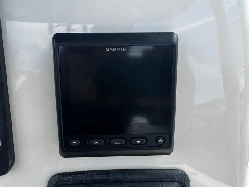 Slide: The Image of Garmin display on 2015 Cobia 237 Center Console boat dashboard. - 26