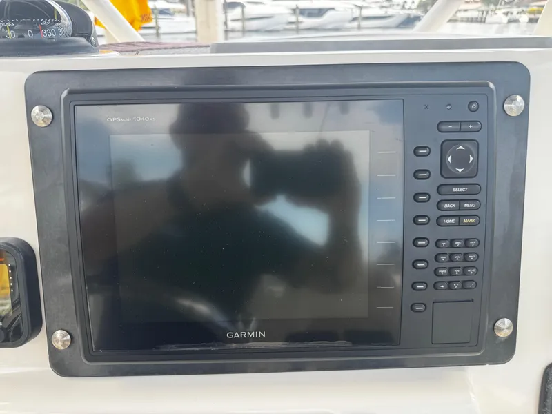 Slide: The Image of Garmin GPSmap 1040xs on 2015 Cobia 237 Center Console boat dashboard. - 27