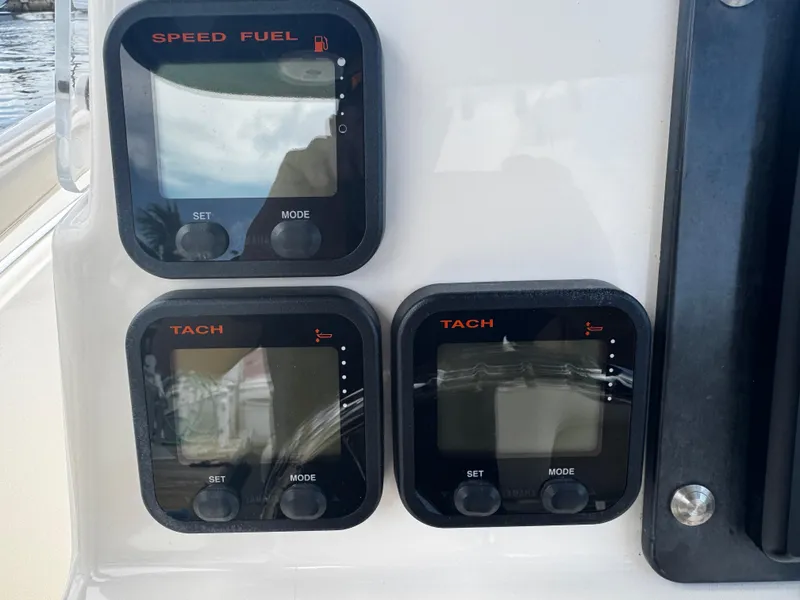 Slide: The Image of 2015 Cobia 237 Center Console dashboard with speed, fuel, and tachometer displays. - 28