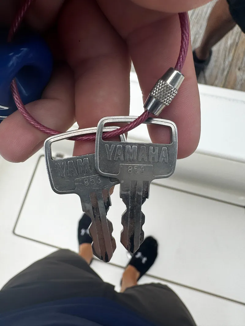 Slide: The Image of Close-up of Yamaha keys for a 2015 Cobia 237 Center Console boat. - 35